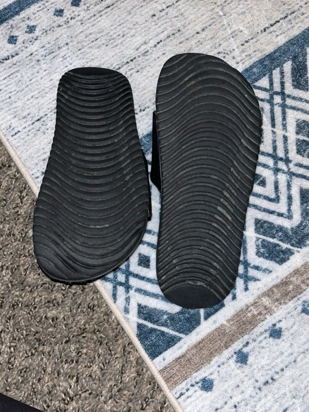 Nike Kids Black Slide Sandals with White Swoosh Accent